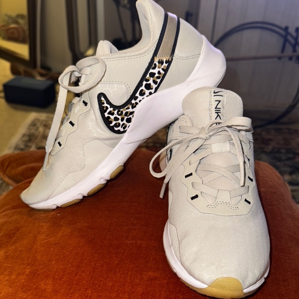 Woman’s size 7 Nike Women's Cream Sneakers with Leopard Detail